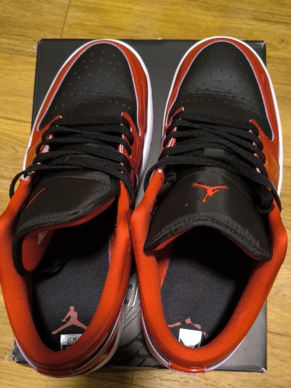 Jordan 1 Men’s Low-Top Sneakers in Black and Red